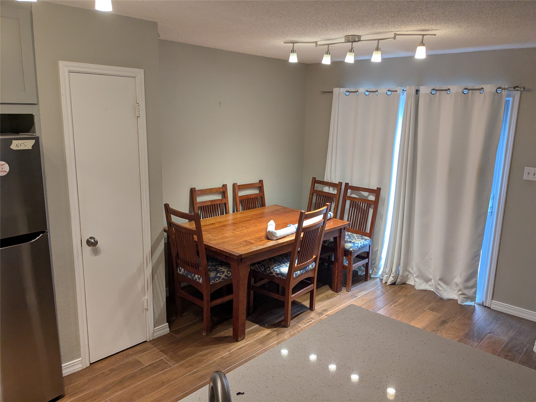 2502 Charla Circle Austin, TX 78728 - Photo 12 of 14 This naturally illuminated dining area offers ample space for gathering, complemented by the warmth of wood-look flooring.