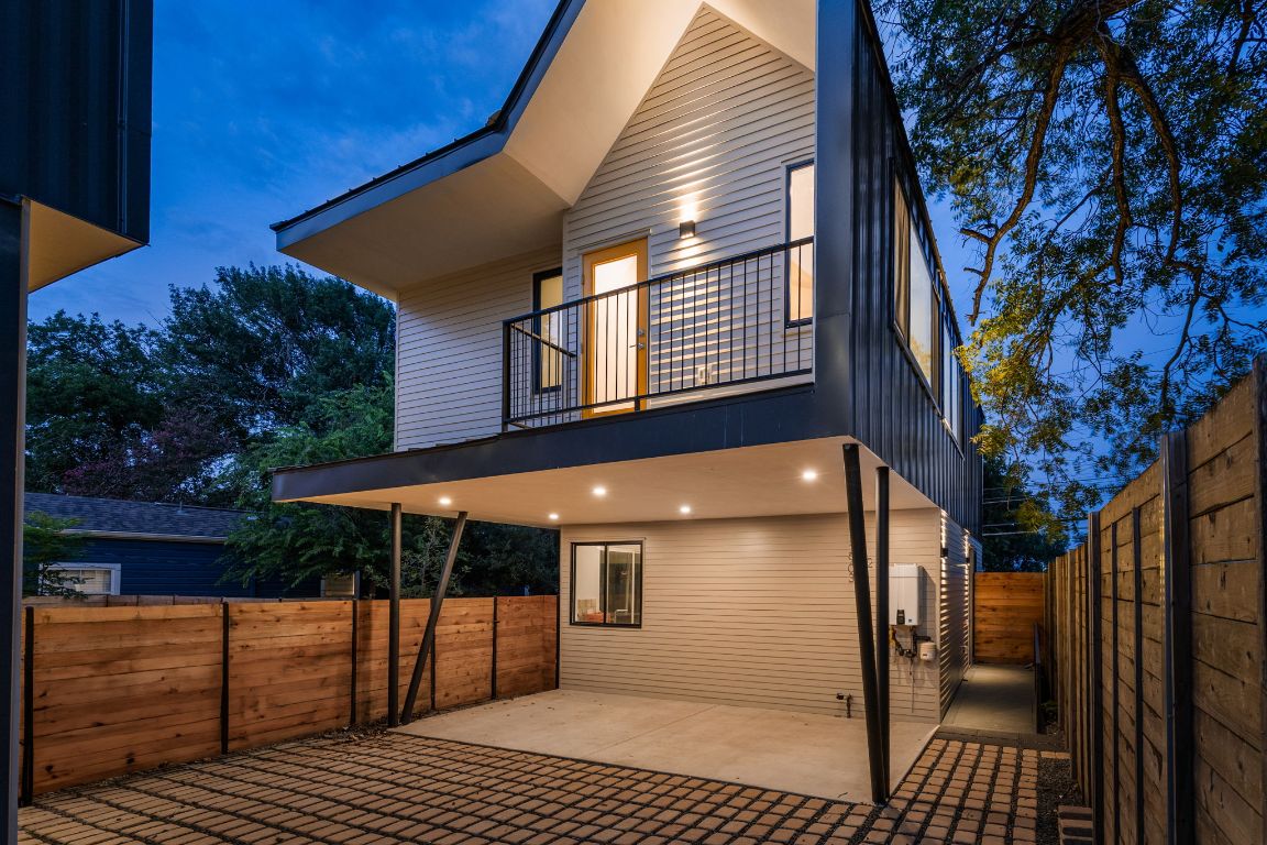 2903 Breeze Terrace, Unit 2 Austin, TX 78722 - Photo 1 of 36 Rear view of house featuring a balcony, a patio area, and a fenced backyard