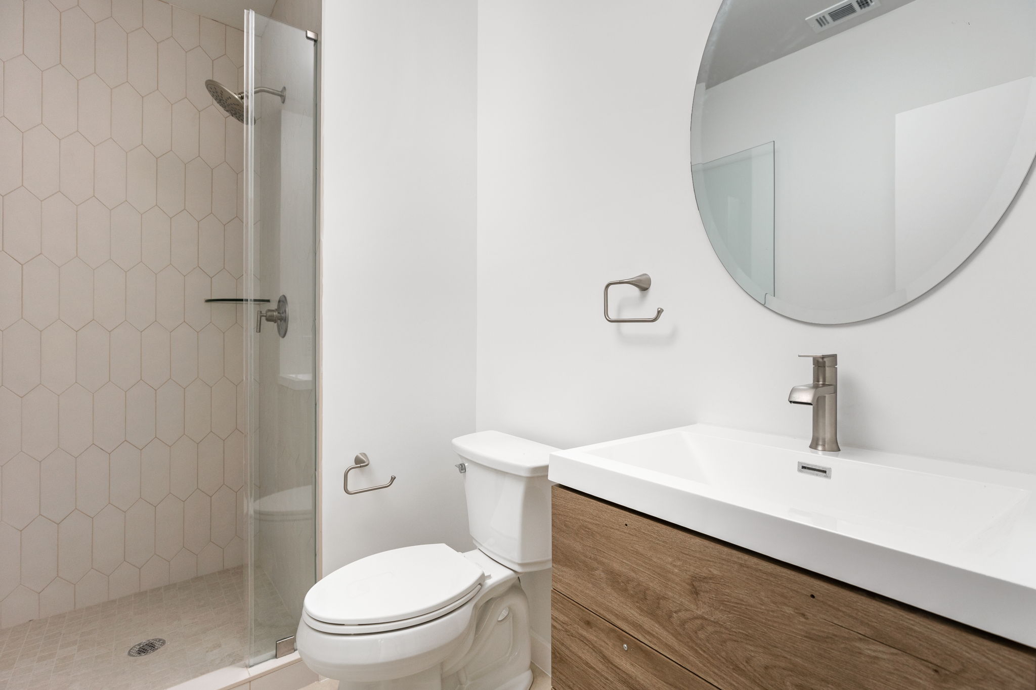 2903 Breeze Terrace, Unit 2 Austin, TX 78722 - Photo 26 of 36 Bathroom featuring toilet, a shower stall, and vanity