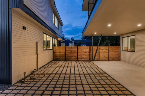 a view of a pathway with a backyard