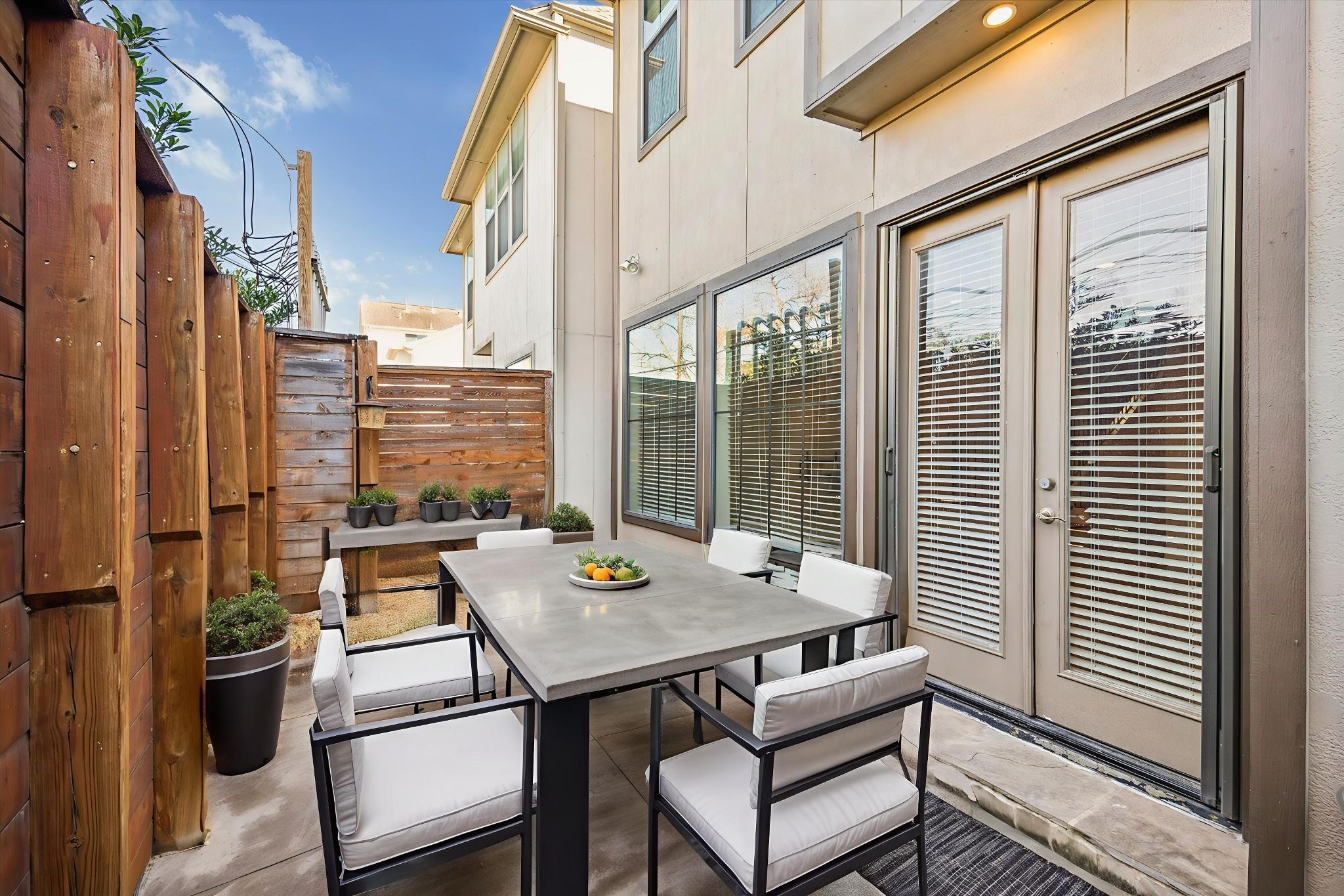 5749 Larkin Street Houston, TX 77007 - Photo 17 of 35 The back patio is fully fenced in, has a high modern fence, and is ready for outdoor furniture. This photo is virtually staged.