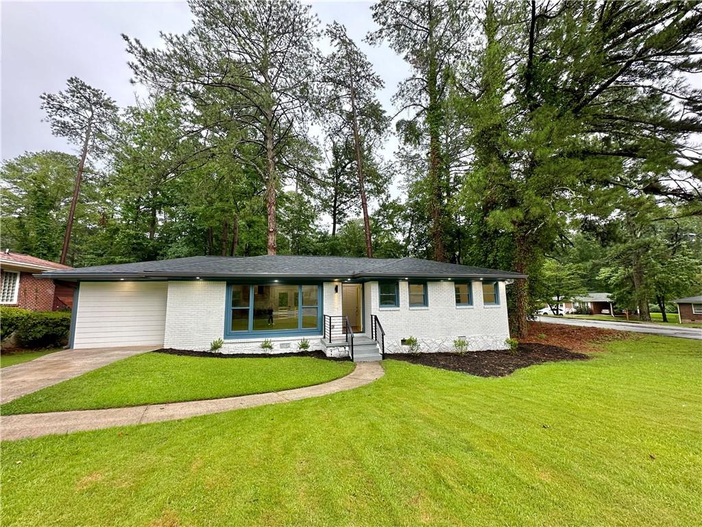 1496 Alverado Way Decatur, GA 30032 - Photo 1 of 1 a front view of house with yard and outdoor seating