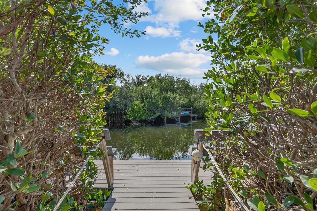 7108 Midnight Pass Road Sarasota, FL 34242 - Photo 56 of 83 a view of a lake from a garden