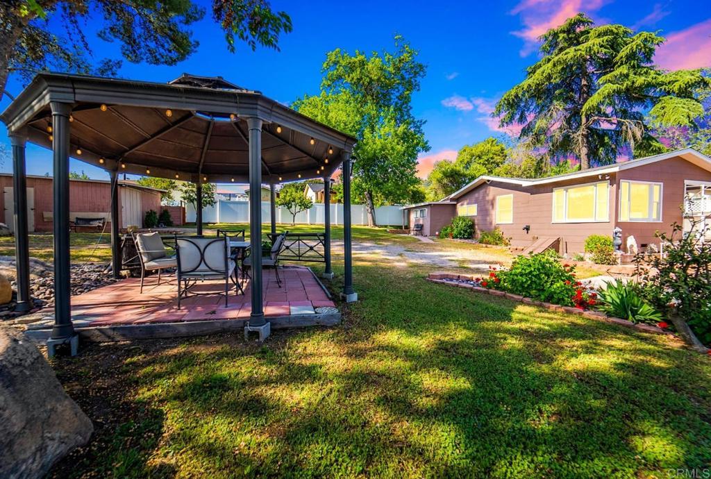 a view of yard with patio
