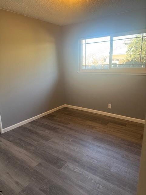 2720 Glen Avenue Merced, CA 95340 - Photo 5 of 7 a view of an empty room with wooden floor and a window