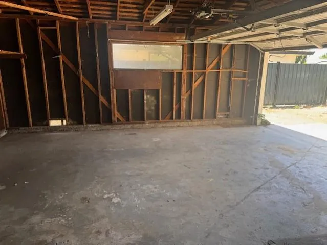 a view of an empty room with wooden walls