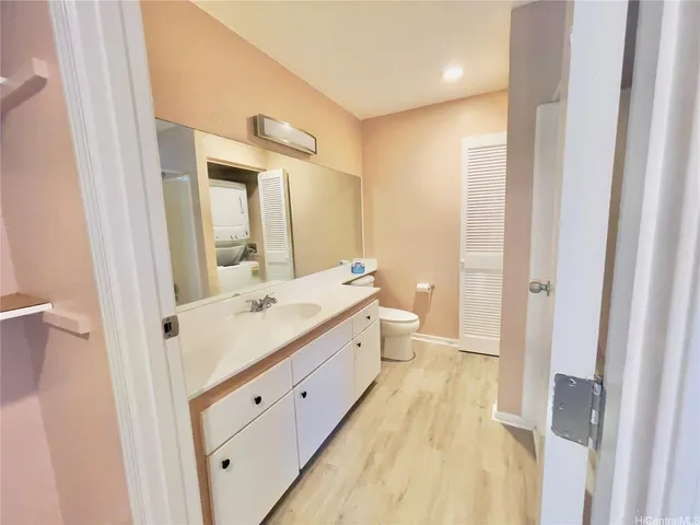 a spacious bathroom with a double vanity sink and a mirror