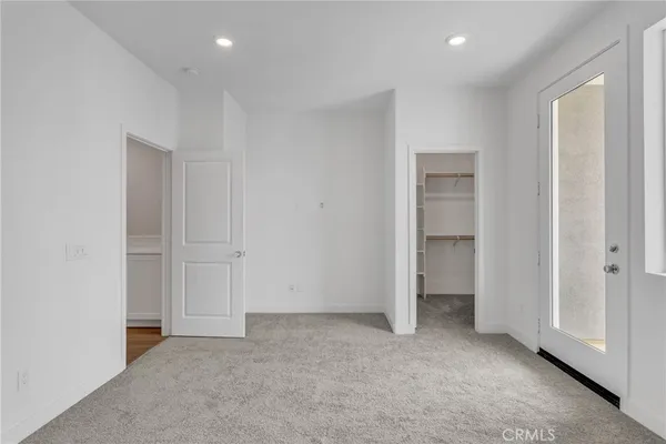 an empty room with closet area