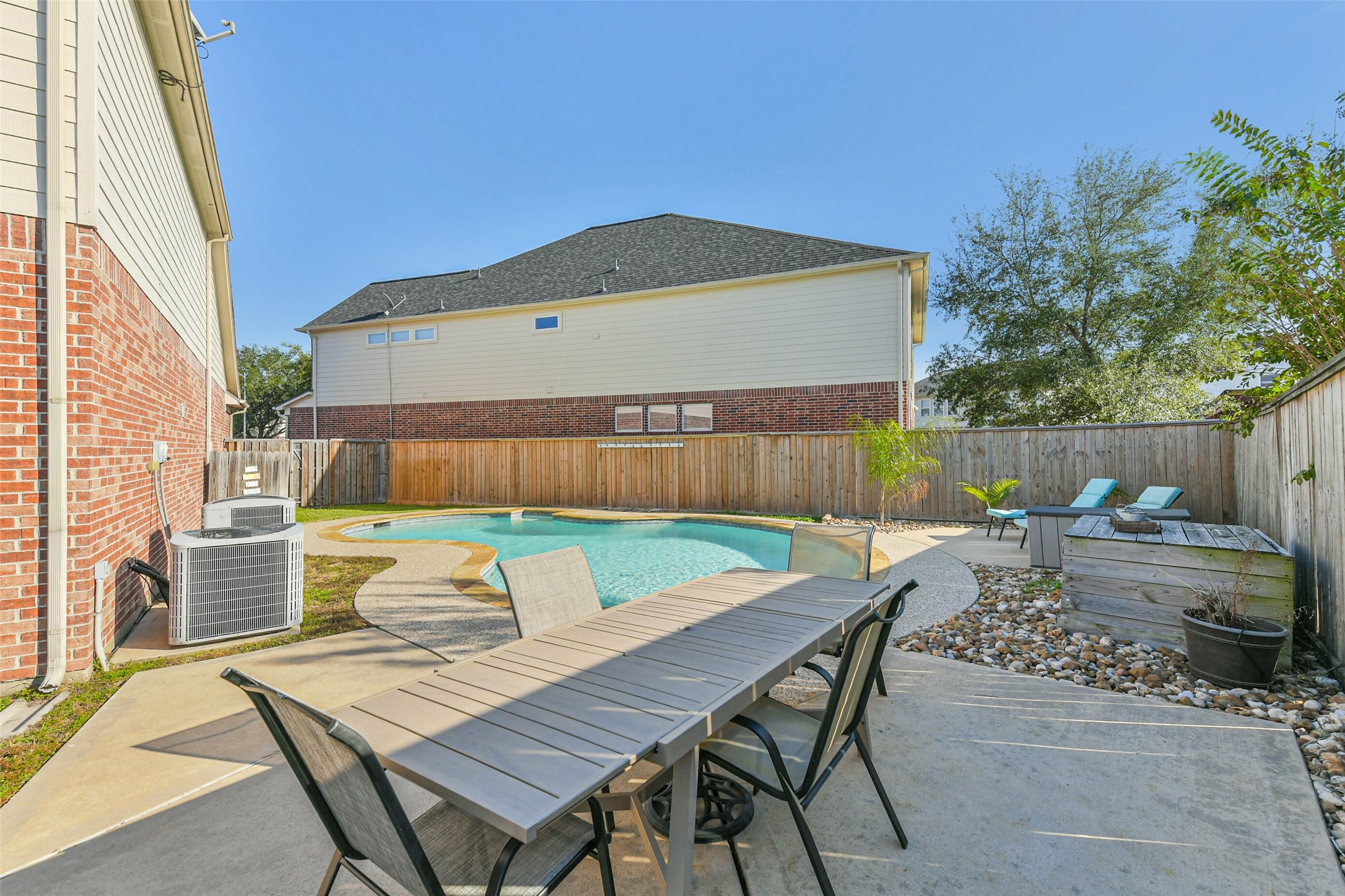 19022 Greenleaf Ridge Court Cypress, TX 77429 - Photo 29 of 47 a view of a table and chairs in back yard of the house