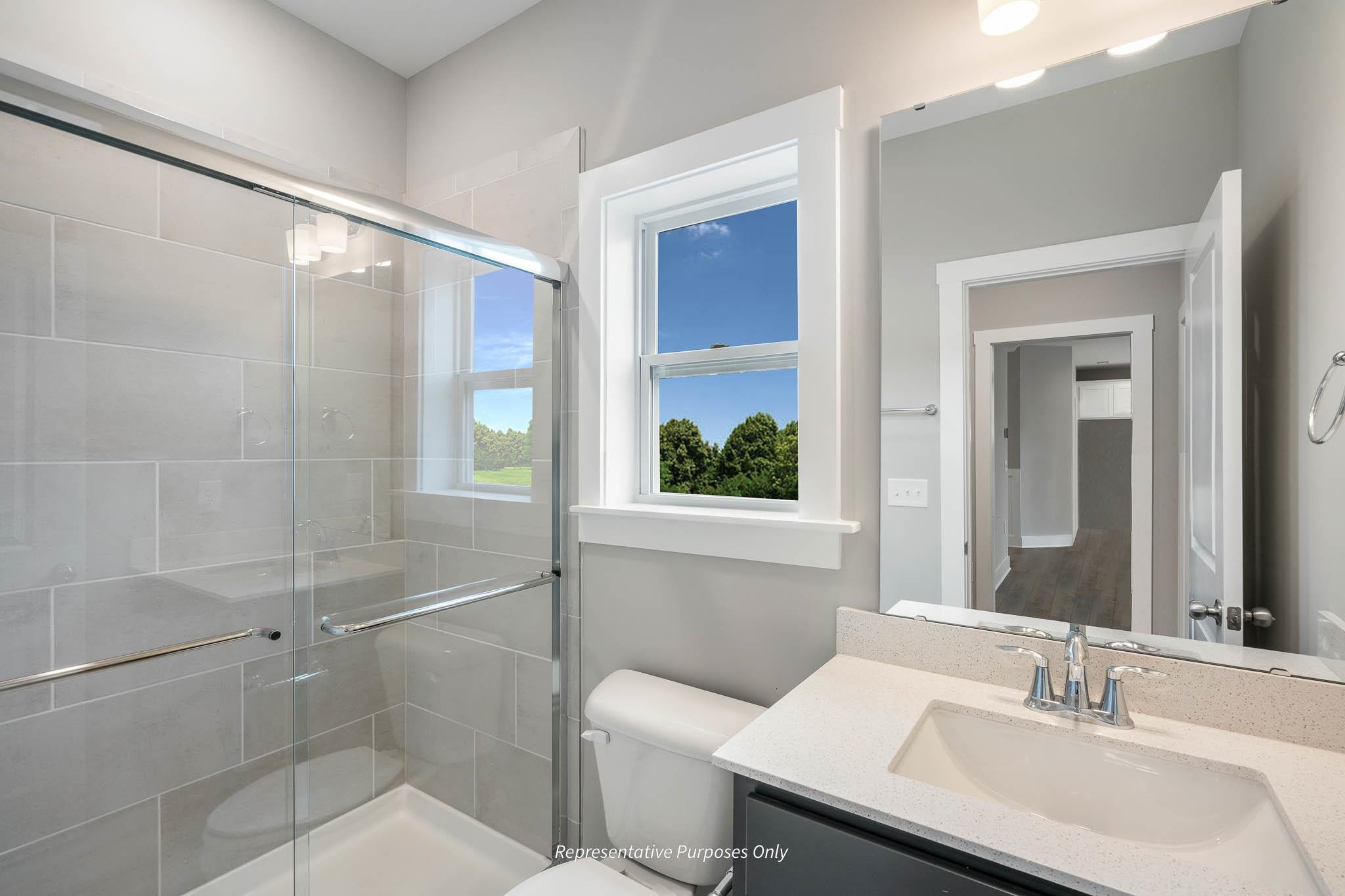 34 Beacon Hl Road Lillington, NC 27546 - Photo 20 of 41 a bathroom with a sink toilet and shower