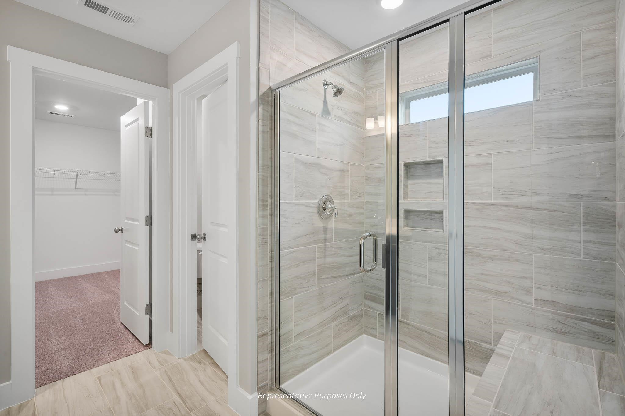 34 Beacon Hl Road Lillington, NC 27546 - Photo 30 of 41 a bathroom with a glass shower door