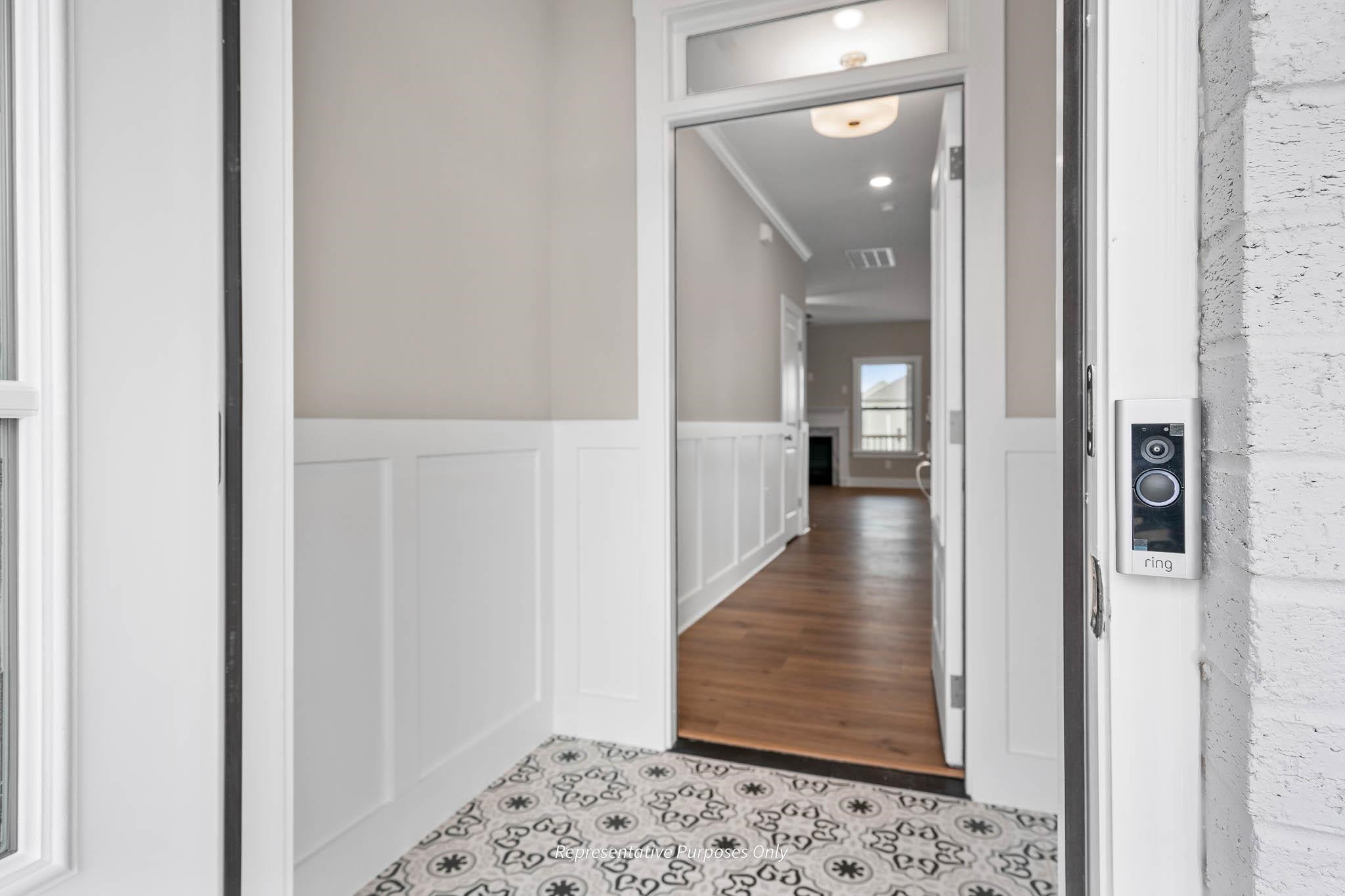 34 Beacon Hl Road Lillington, NC 27546 - Photo 7 of 41 a view of a hallway with wooden floor and a living room