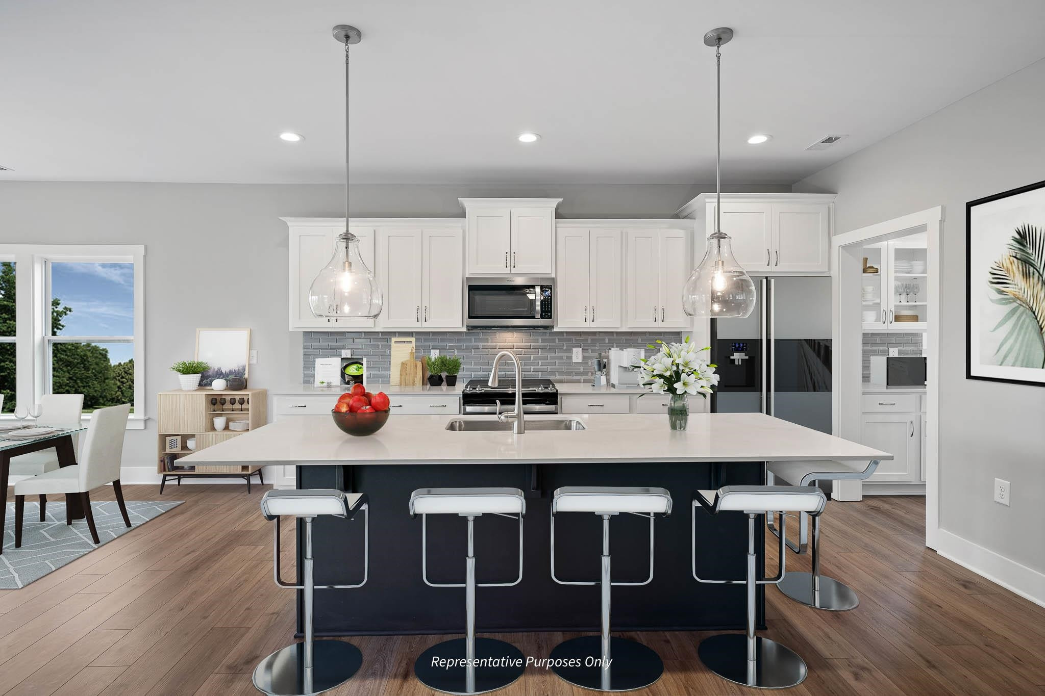 34 Beacon Hl Road Lillington, NC 27546 - Photo 10 of 41 a kitchen with stainless steel appliances granite countertop a stove a refrigerator a kitchen island a table and chairs
