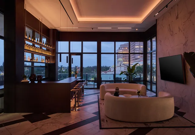 a lobby with furniture and rug