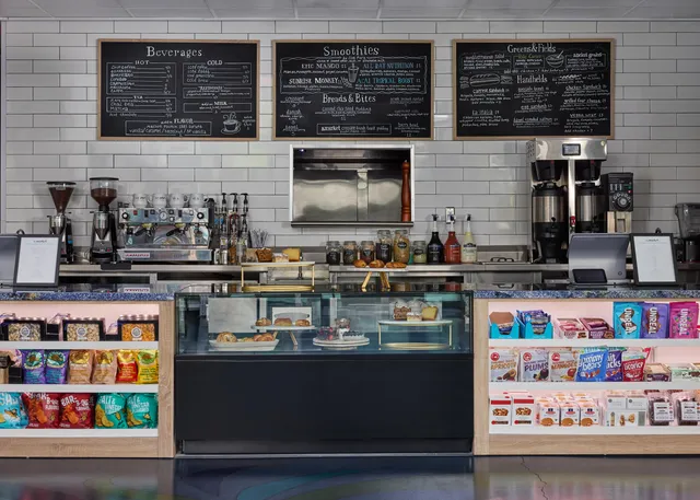 a view of a dining room with furniture and a flat screen tv