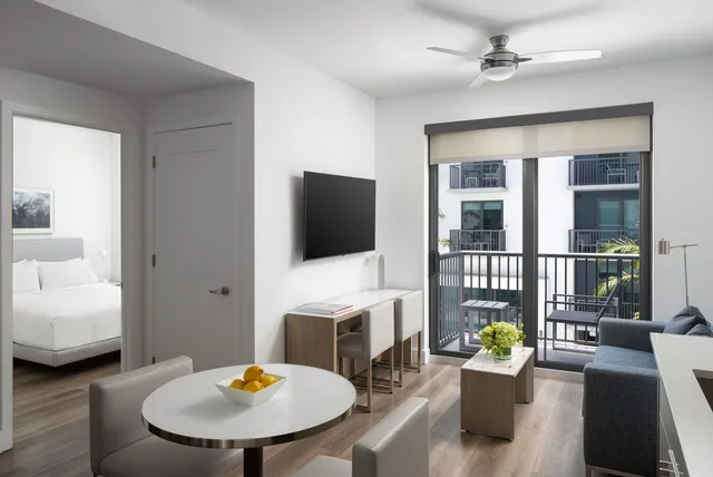 a living room with furniture fireplace and a flat screen tv