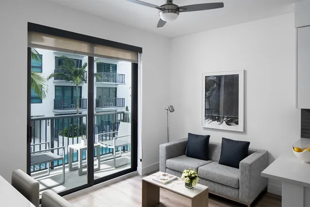 a living room with furniture and a window