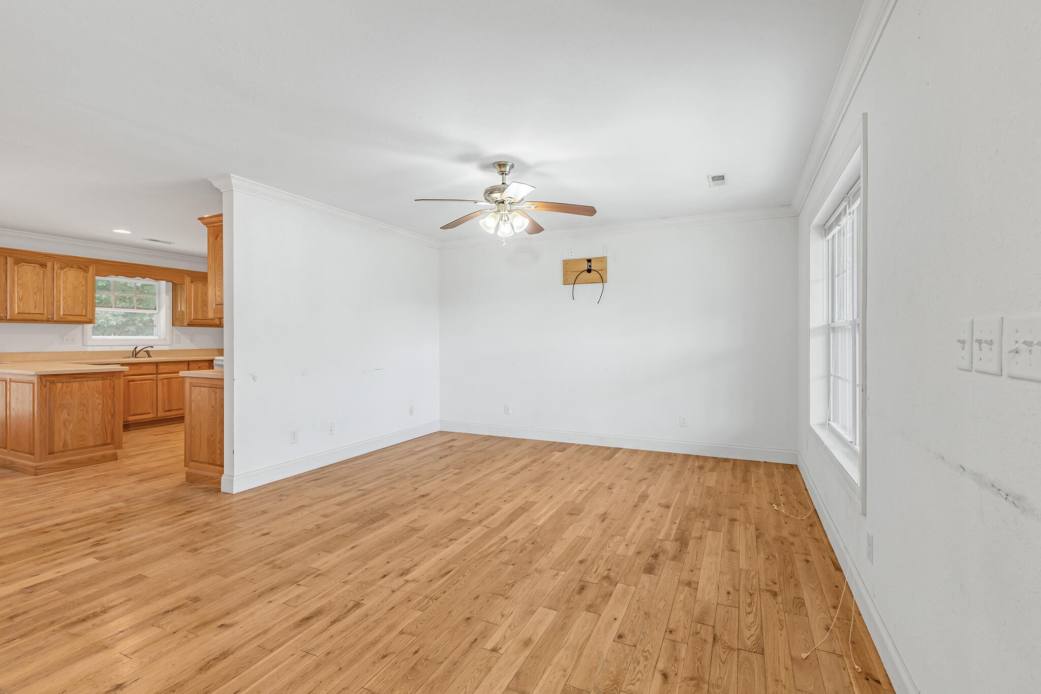 173 Hidden Meadow Lane Dunlap, TN 37327 - Photo 5 of 22 wooden floor in an empty room with a window