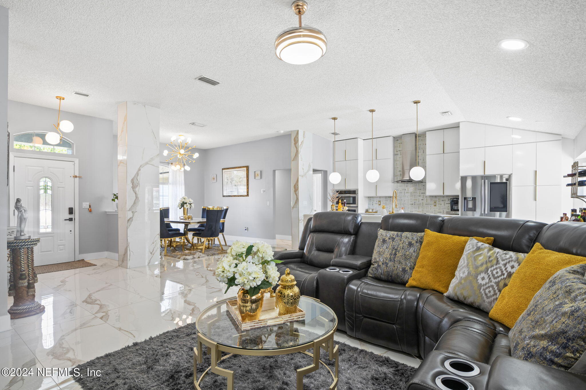 487 Portobello Drive Jacksonville, FL 32221 - Photo 4 of 9 a living room with furniture kitchen view and a table