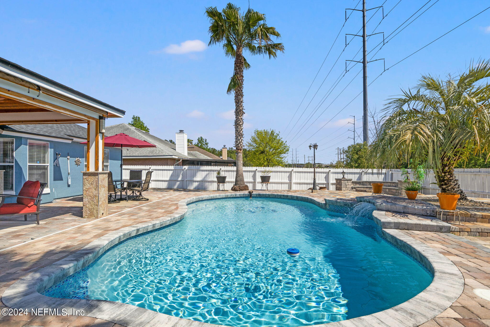 487 Portobello Drive Jacksonville, FL 32221 - Photo 8 of 9 a view of a swimming pool with a lounge chair