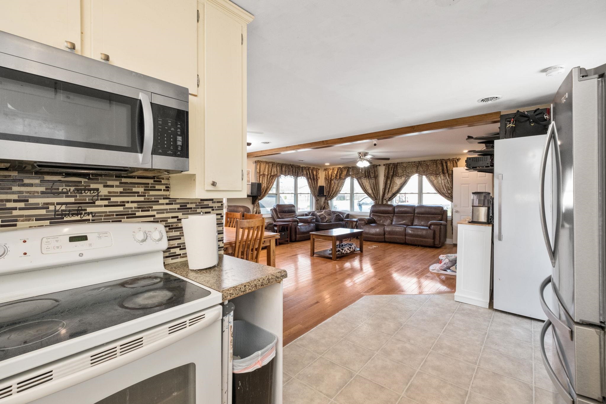 8208 George Wine Road Bridgewater, VA 22812 - Photo 6 of 27 a kitchen with a stove a microwave and refrigerator
