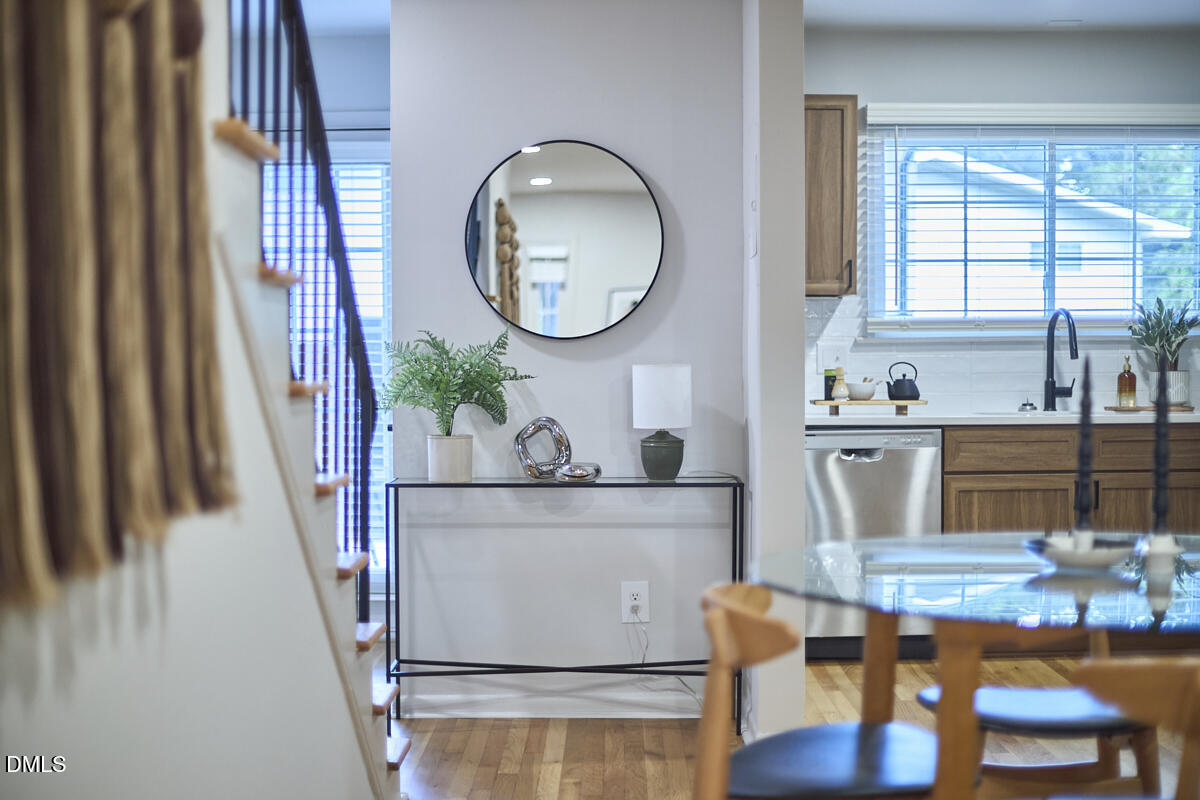 2613 McNeil Street, Unit B Raleigh, NC 27608 - Photo 15 of 31 a living room with furniture and a mirror