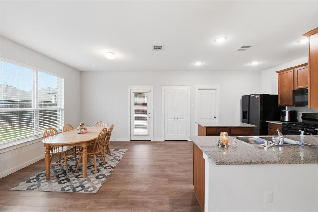 4228 Bullock Lane Forney, TX 75126 - Photo 19 of 40 a dining room with furniture and a large window