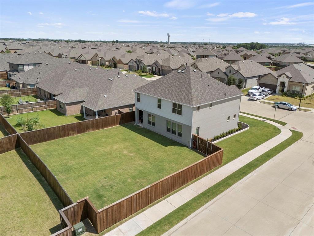 4228 Bullock Lane Forney, TX 75126 - Photo 2 of 40 an aerial view of residential houses with outdoor space and seating area