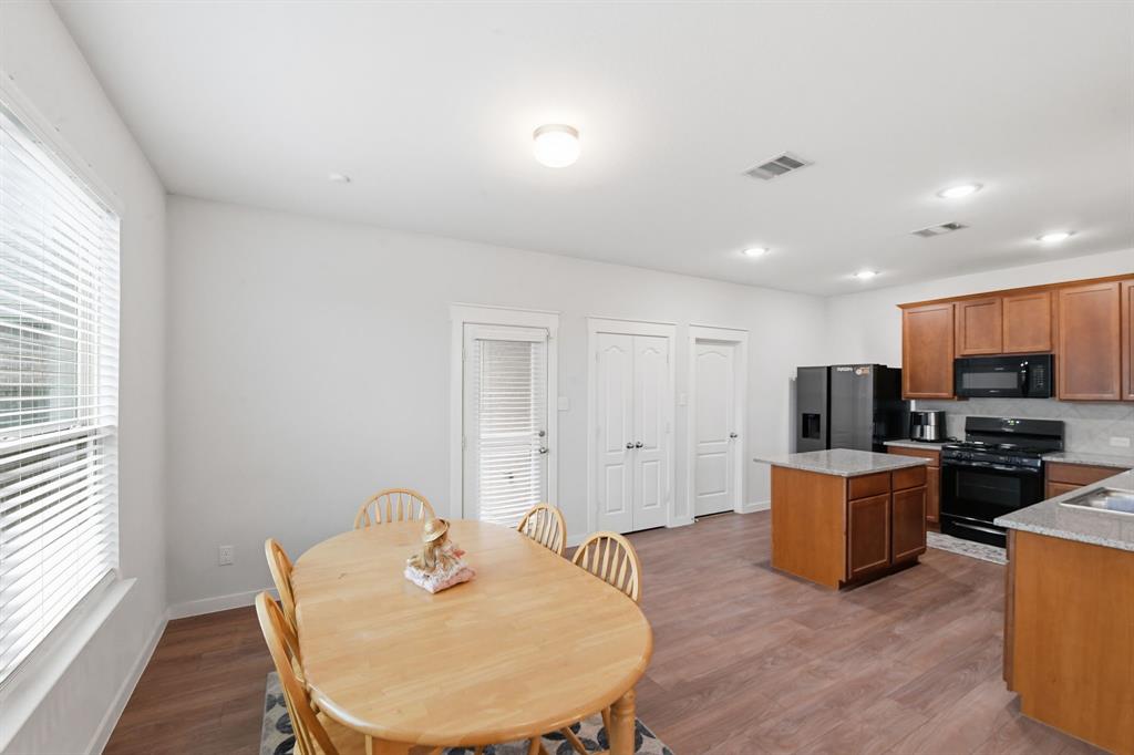 4228 Bullock Lane Forney, TX 75126 - Photo 21 of 40 a living room with furniture and a wooden floor