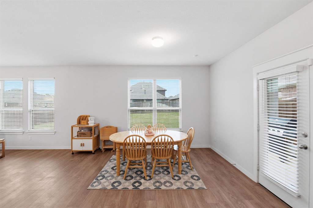 4228 Bullock Lane Forney, TX 75126 - Photo 22 of 40 a living room with furniture and a window