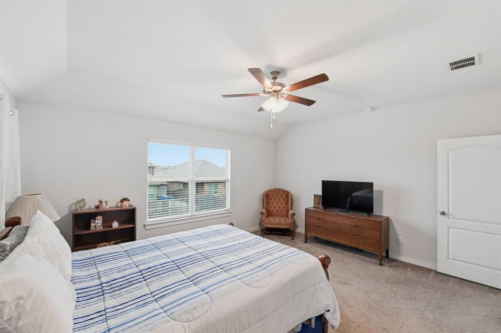 4228 Bullock Lane Forney, TX 75126 - Photo 28 of 40 a bedroom with bed and window