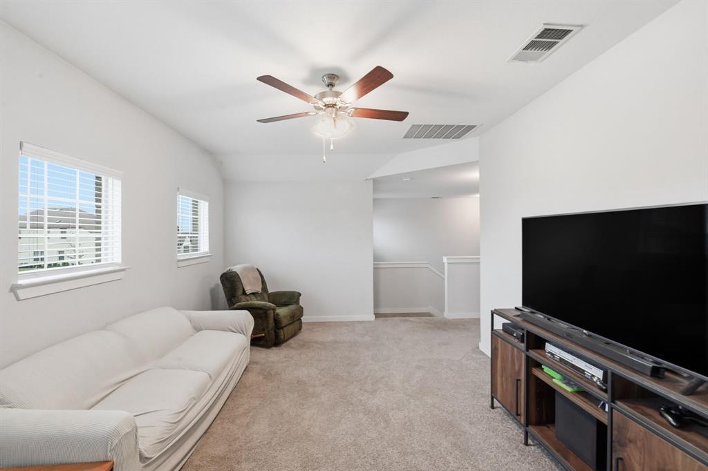 4228 Bullock Lane Forney, TX 75126 - Photo 35 of 40 a living room with furniture and a flat screen tv
