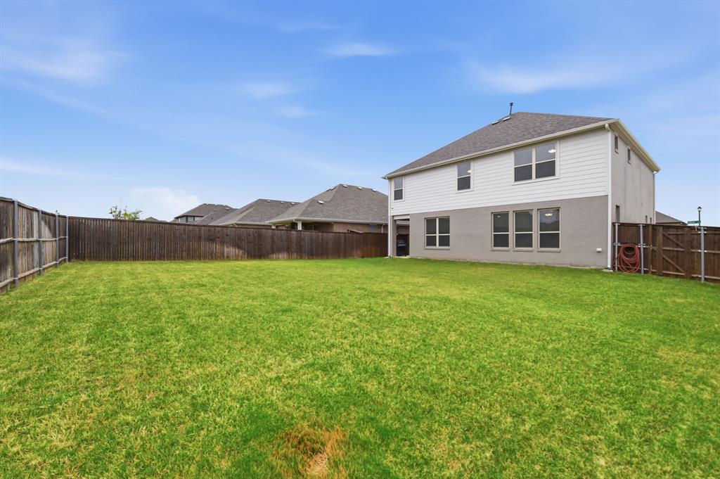 4228 Bullock Lane Forney, TX 75126 - Photo 37 of 40 a view of a house with a yard and sitting area