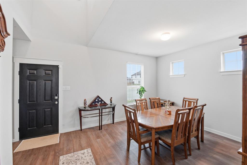 4228 Bullock Lane Forney, TX 75126 - Photo 6 of 40 a view of a dining room with furniture and wooden floor