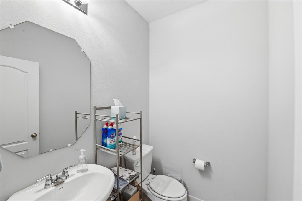 4228 Bullock Lane Forney, TX 75126 - Photo 8 of 40 a bathroom with a sink mirror and toilet