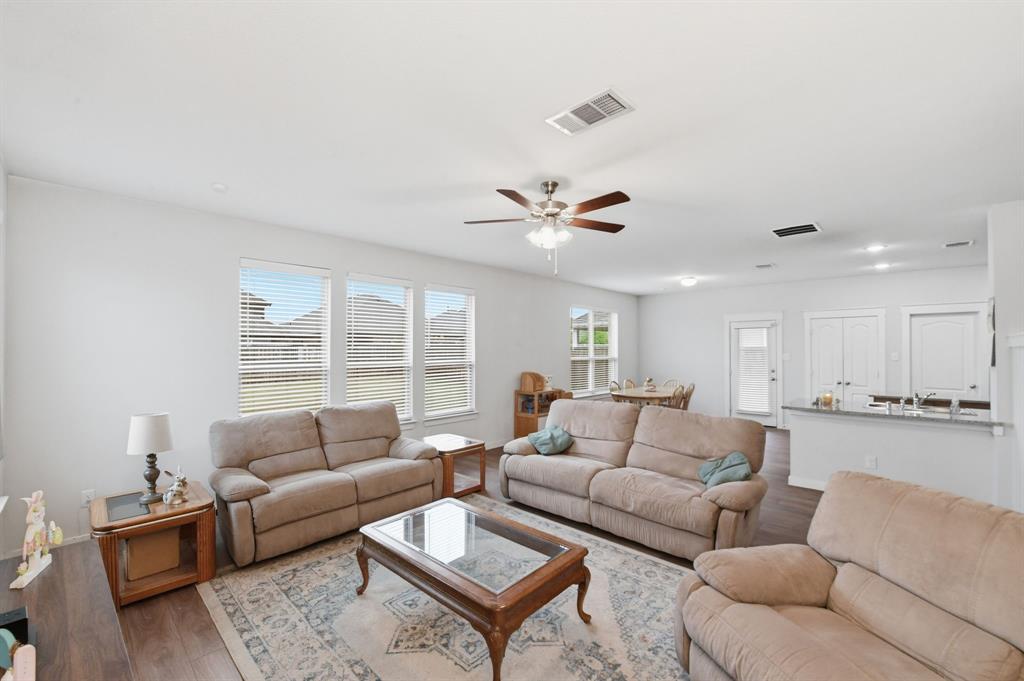 4228 Bullock Lane Forney, TX 75126 - Photo 10 of 40 a living room with furniture and a large window