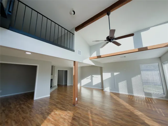 a view of an entryway with wooden floor