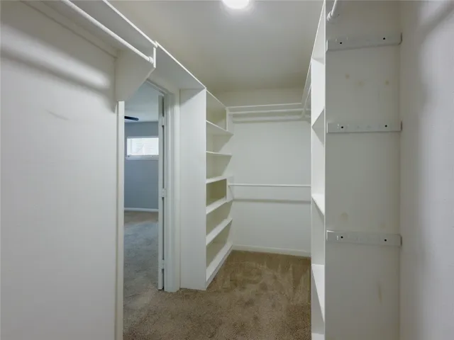 a bathroom with double sink and two mirror