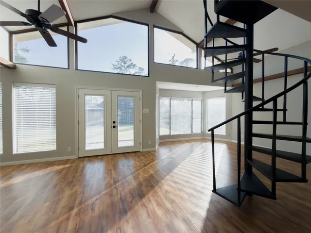 a view of entryway with wooden floor and stairs