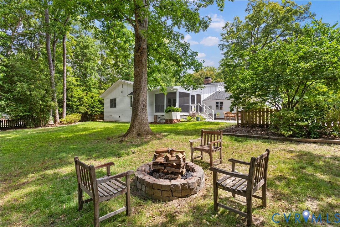 3136 Old Quarry Road Richmond, VA 23225 - Photo 21 of 39 Expansive backyard featuring a stone-lined fire pi