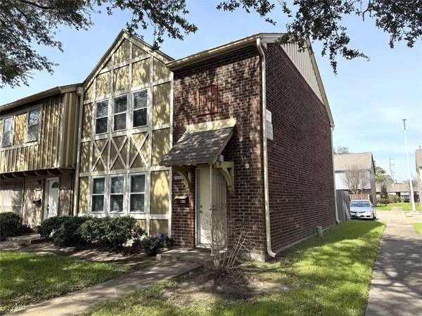 a view of a building with a yard