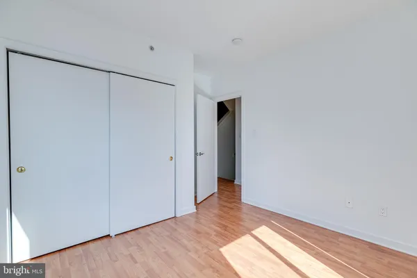 a view of hallway with wooden floor