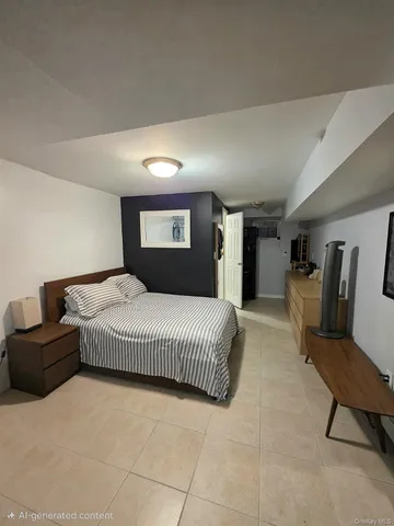 a bedroom with a large bed and a couch