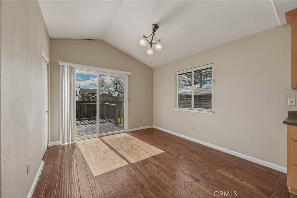 3483 Beach Street Nice, CA 95464 - Photo 11 of 40 wooden floor in an empty room with a window