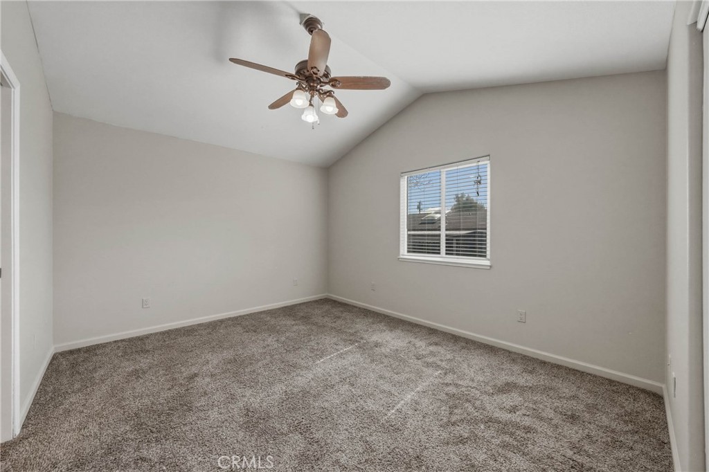 3483 Beach Street Nice, CA 95464 - Photo 13 of 40 a view of a big room with windows and chandelier fan