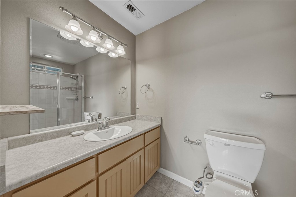 3483 Beach Street Nice, CA 95464 - Photo 15 of 40 a bathroom with a sink a light fixture and a mirror