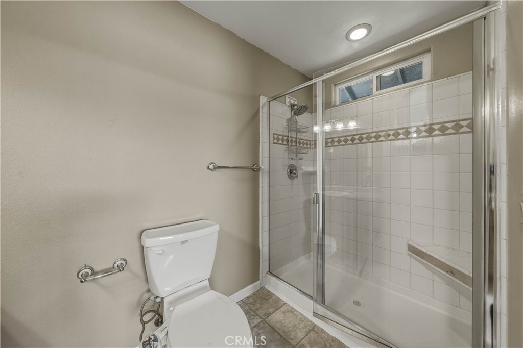 3483 Beach Street Nice, CA 95464 - Photo 16 of 40 a bathroom with a toilet and a shower
