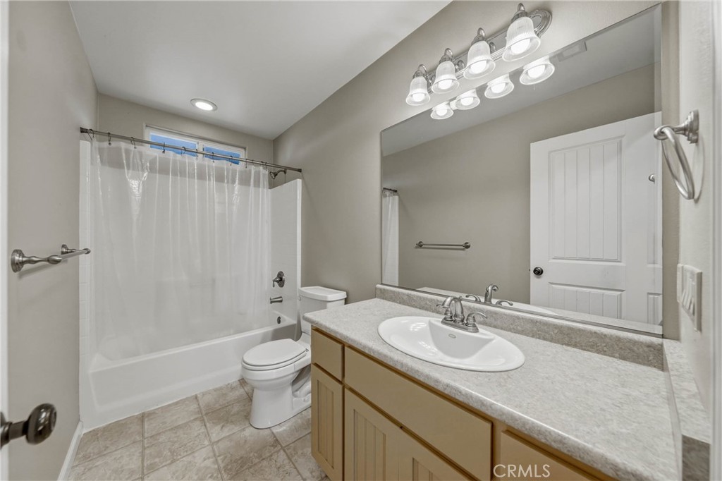 3483 Beach Street Nice, CA 95464 - Photo 20 of 40 a bathroom with a granite countertop sink a toilet and shower