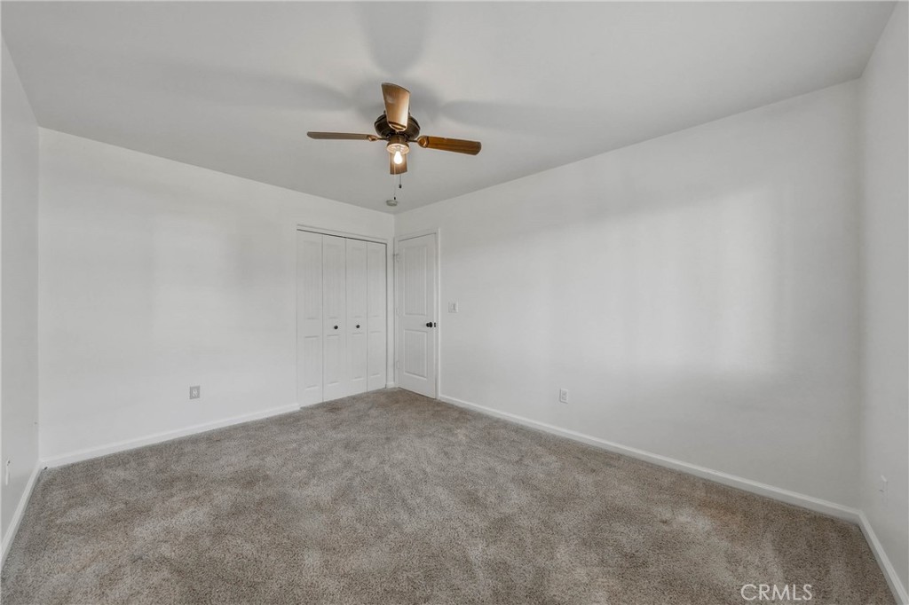 3483 Beach Street Nice, CA 95464 - Photo 22 of 40 a view of room with a ceiling fan and window