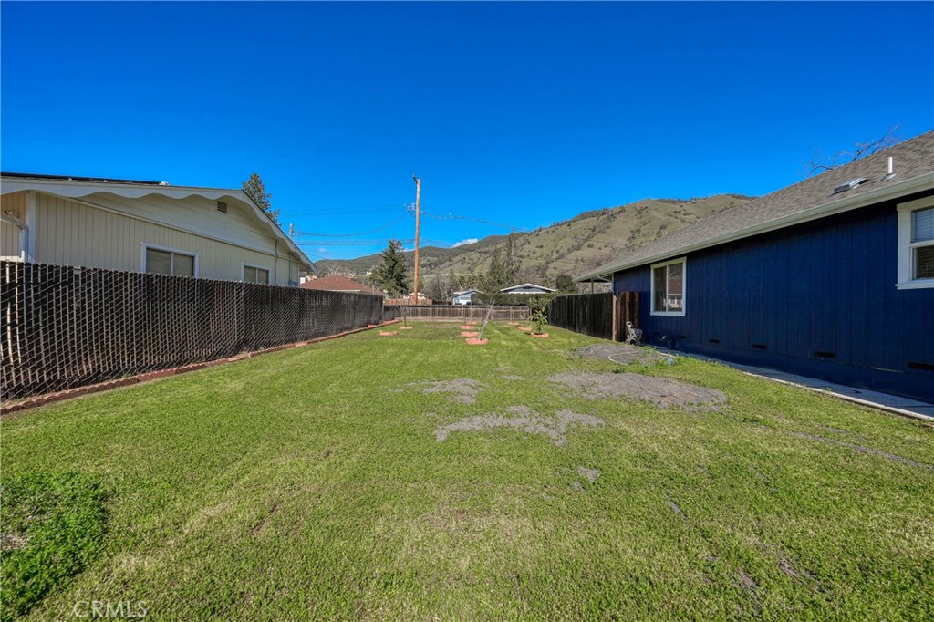 3483 Beach Street Nice, CA 95464 - Photo 32 of 40 a view of a backyard with a large tree